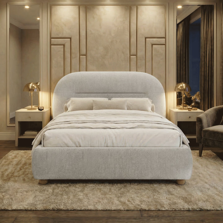 [Grey | King] Night-time styled room with brass mushroom lamps casting warm glow on upholstered bed and decorative panelling