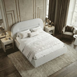 [Grey | King] Overhead corner view showing full bed with textured white duvet and cushions on shag rug in art deco room