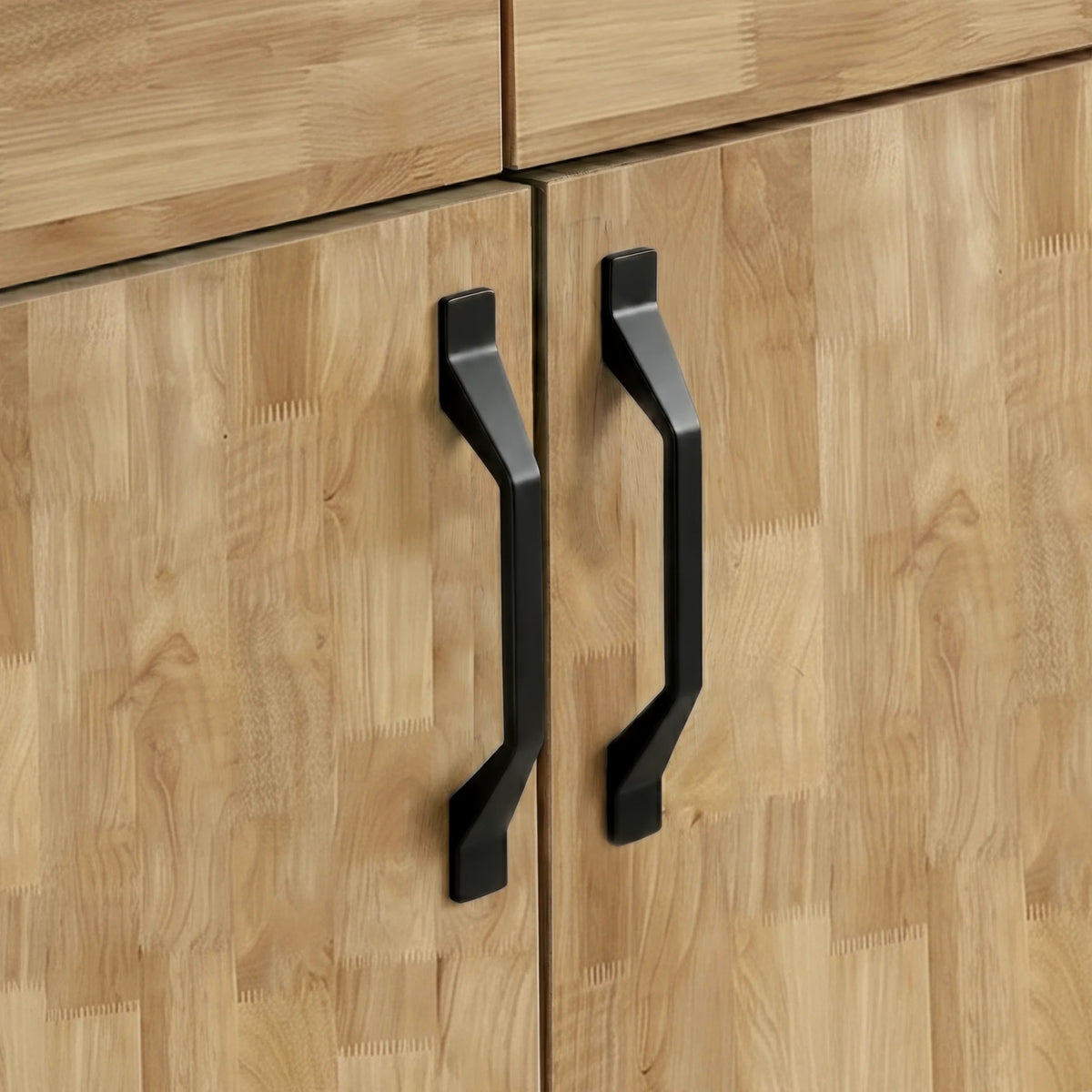 [Mango Wood Effect] Ironmere handle detail showing two black pulls on closed doors, drawer edge, and natural grain pattern.