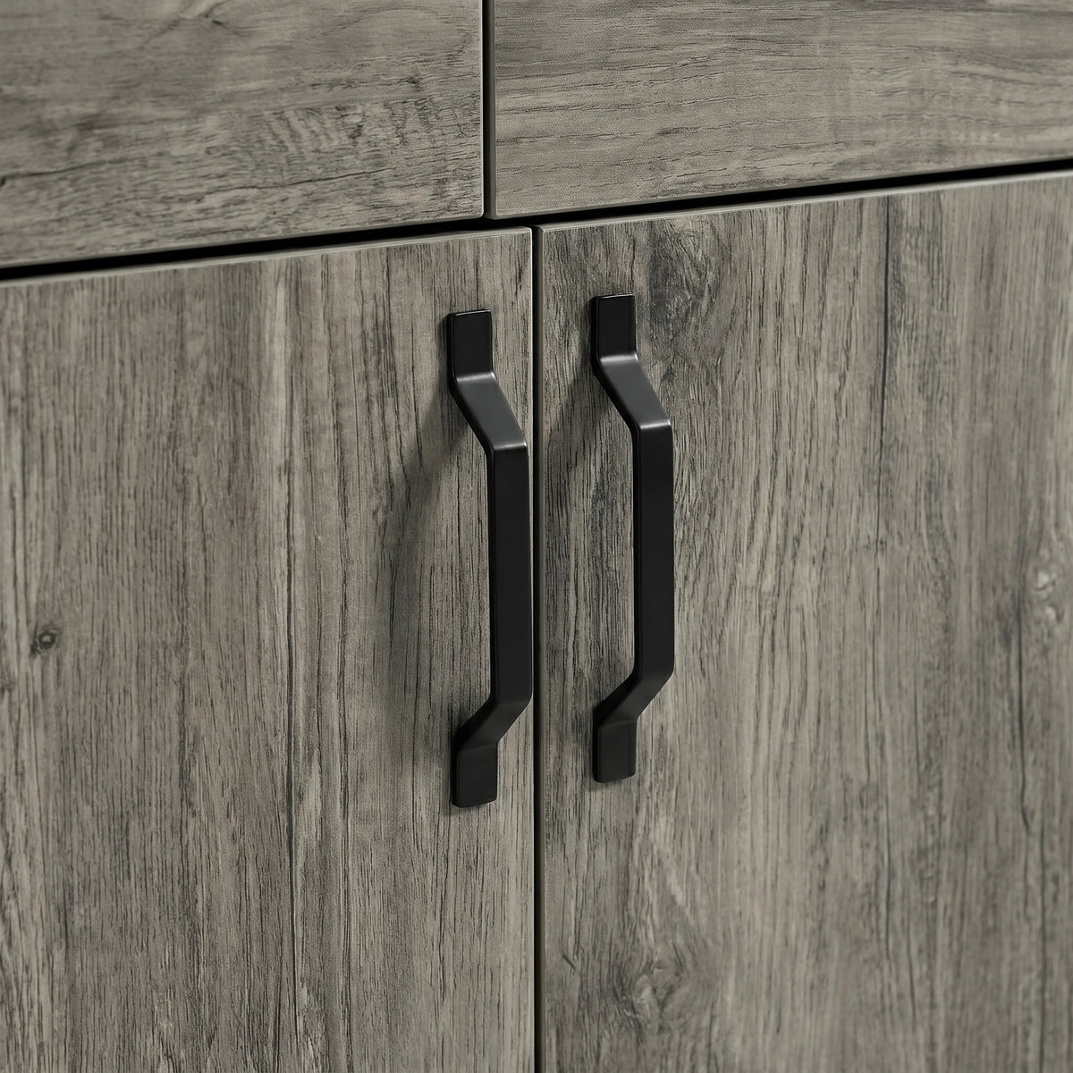 [Wooden Grey] Millwright sideboard close-up showing black angular handles on wooden grey doors