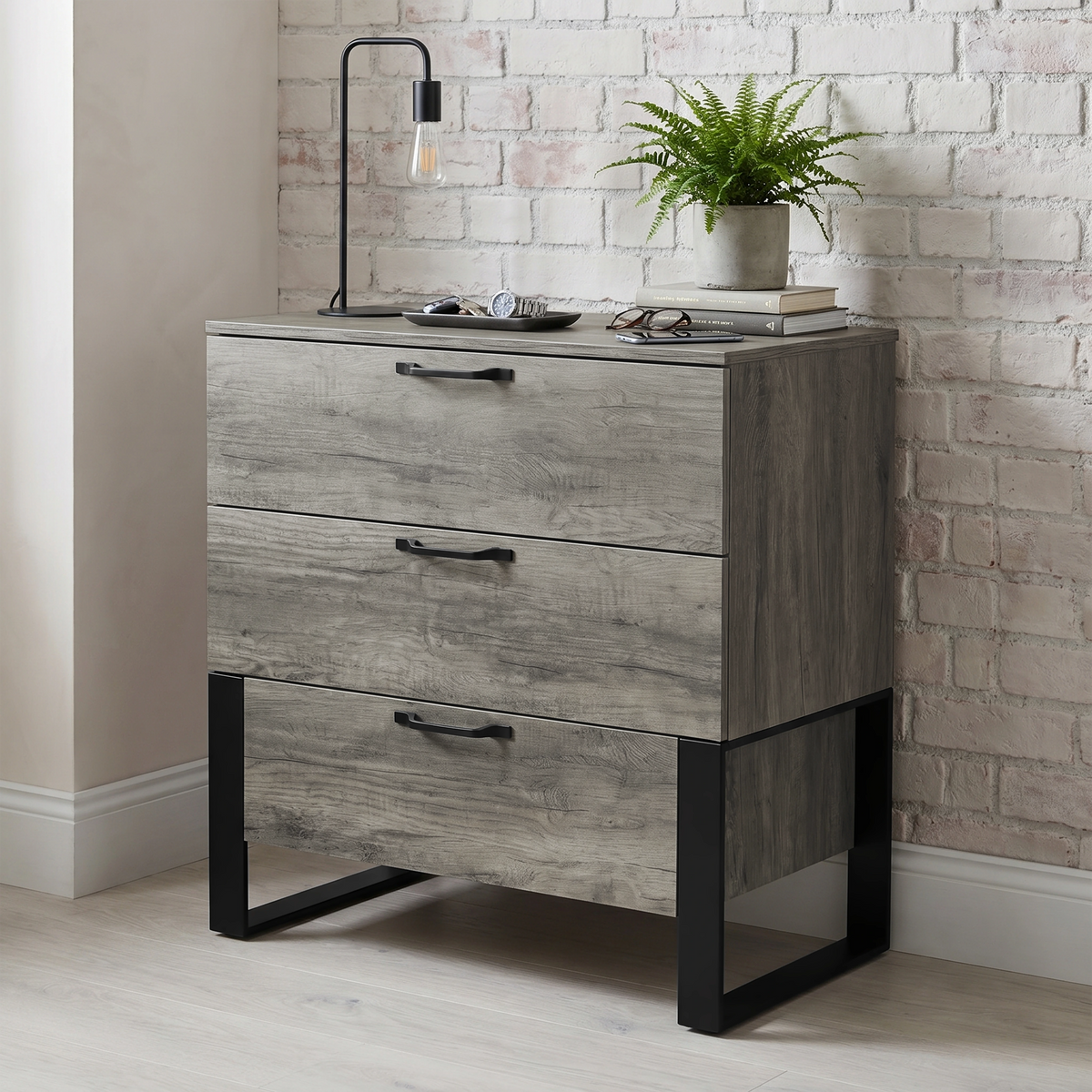 [Wooden Grey] Millwright industrial 3 drawer chest of drawers in an angled room view with decor