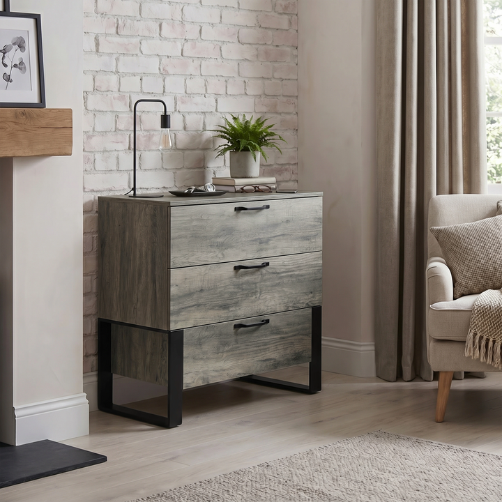 [Wooden Grey] Millwright industrial 3 drawer chest of drawers with black handles in a room view