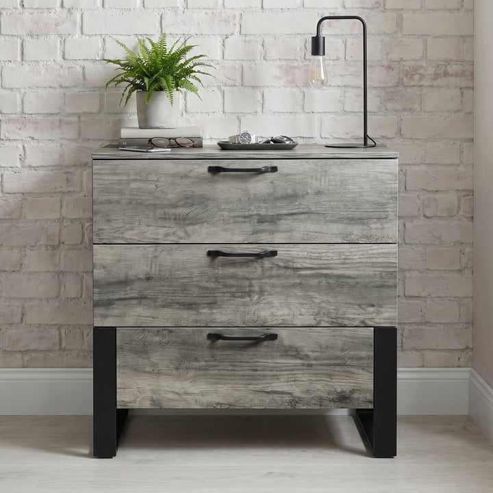 [Wooden Grey] Millwright 3 drawer chest of drawers front view with black handles and raised legs