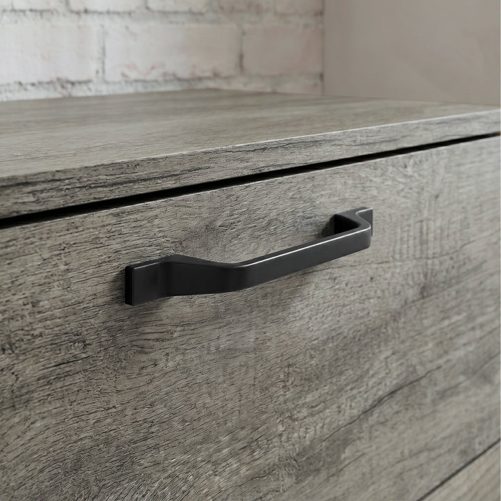[Wooden Grey] Millwright chest of drawers close-up showing black handle on wooden grey drawer front
