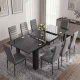 [6 Seater | Grey] Milo black marble-effect table partly opened to show the centre extension leaf and sliding rails