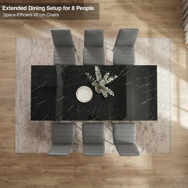 [6 Seater | Grey] Overhead view of the Milo black marble-effect extended dining table layout with space-efficient chairs