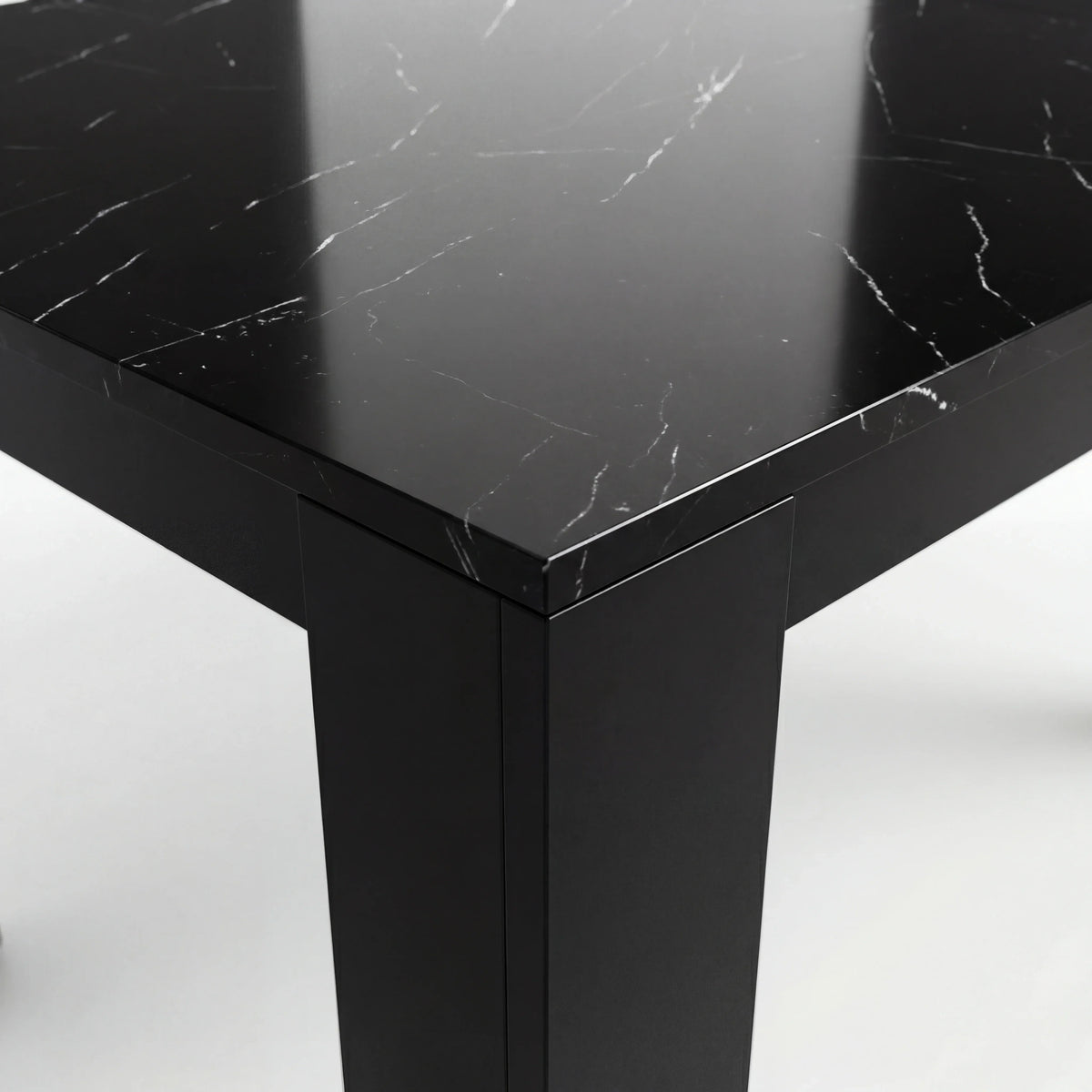 [8 Seater | Black] Close-up of the Milo black marble-effect tabletop edge, surface texture, and inverted-L shaped leg