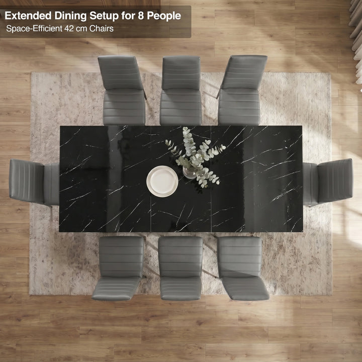[8 Seater | Grey] Overhead view of the Milo black marble-effect extended dining table layout with space-efficient chairs