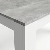 [8 Seater | Black] Close-up of the Milo concrete-effect tabletop edge, surface texture, and white inverted L-shaped leg