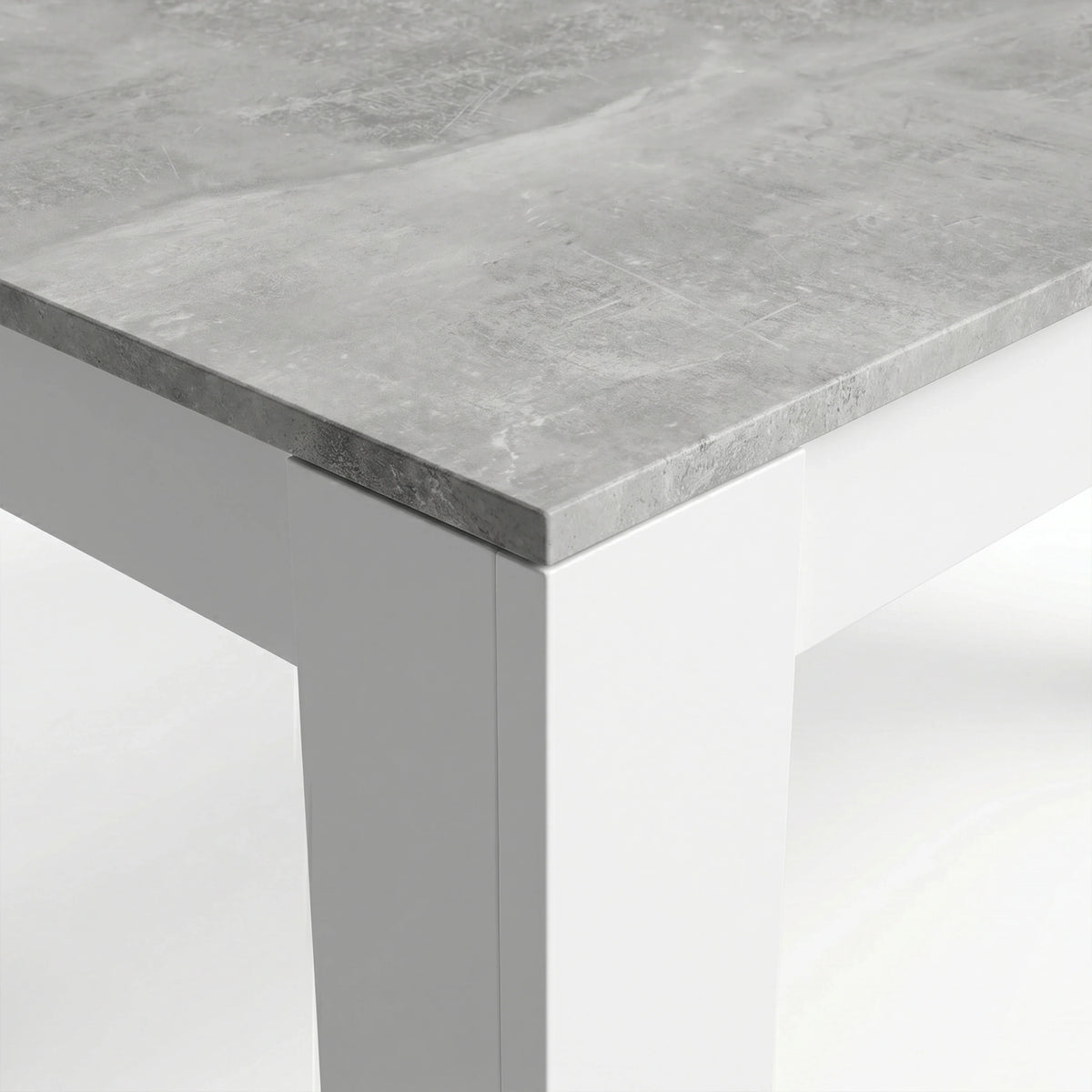 [8 Seater | Grey] Milo concrete-effect tabletop corner close-up showing texture and white inverted L-shaped leg detail