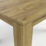 [8 Seater | Black] Close-up of the Milo oak-effect tabletop corner, wood grain, and inverted L-shaped table leg