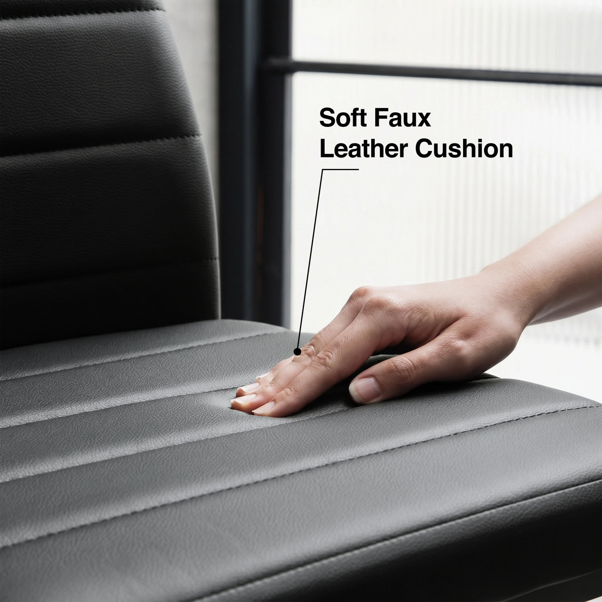 [8 Seater | Black] Close-up of the Milo faux leather chair cushion pressed by a hand