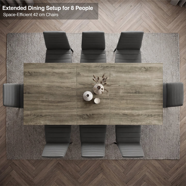[8 Seater | Grey] Overhead view of the Milo wooden grey-effect extended dining table layout with space-efficient chairs