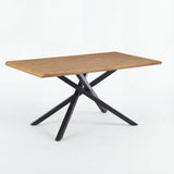 [4 Seater | Grey] Xylon oak dining table angled view with crossed black metal star base on white studio backdrop
