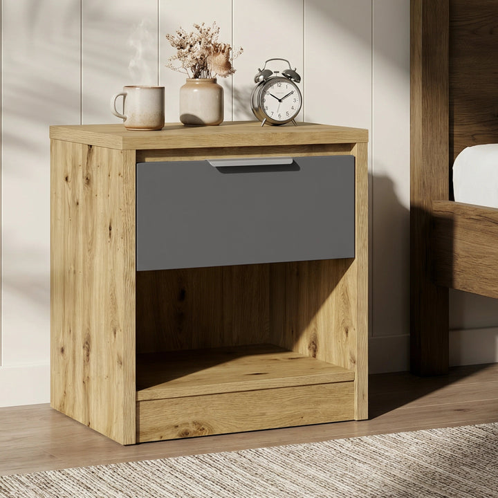 [Oak+Grey] Oak bedside table with grey drawer and open shelf styled beside upholstered bed with lamp and plant