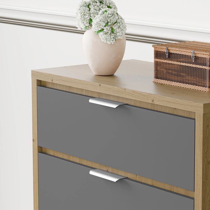 [Oak+Grey] Modern finish chest of drawers with metallic handles placed against a white wall with a vase on top