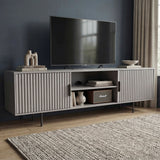 [Grey] Angled grey 180cm TV unit with mounted TV on navy wall, Marshall speaker and ceramic vase on central open shelf.