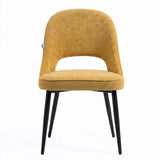 [Mustard | Set of 2] Front view of the comfy modern dining chair with rounded open back, piped seat & four black metal legs.