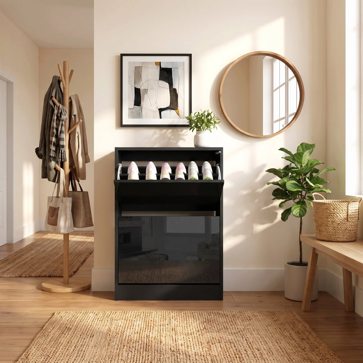 [Black] A modern glossy shoe cabinet with a top shelf opened holding several pair of shoes, styled in a bright, minimalist entryway