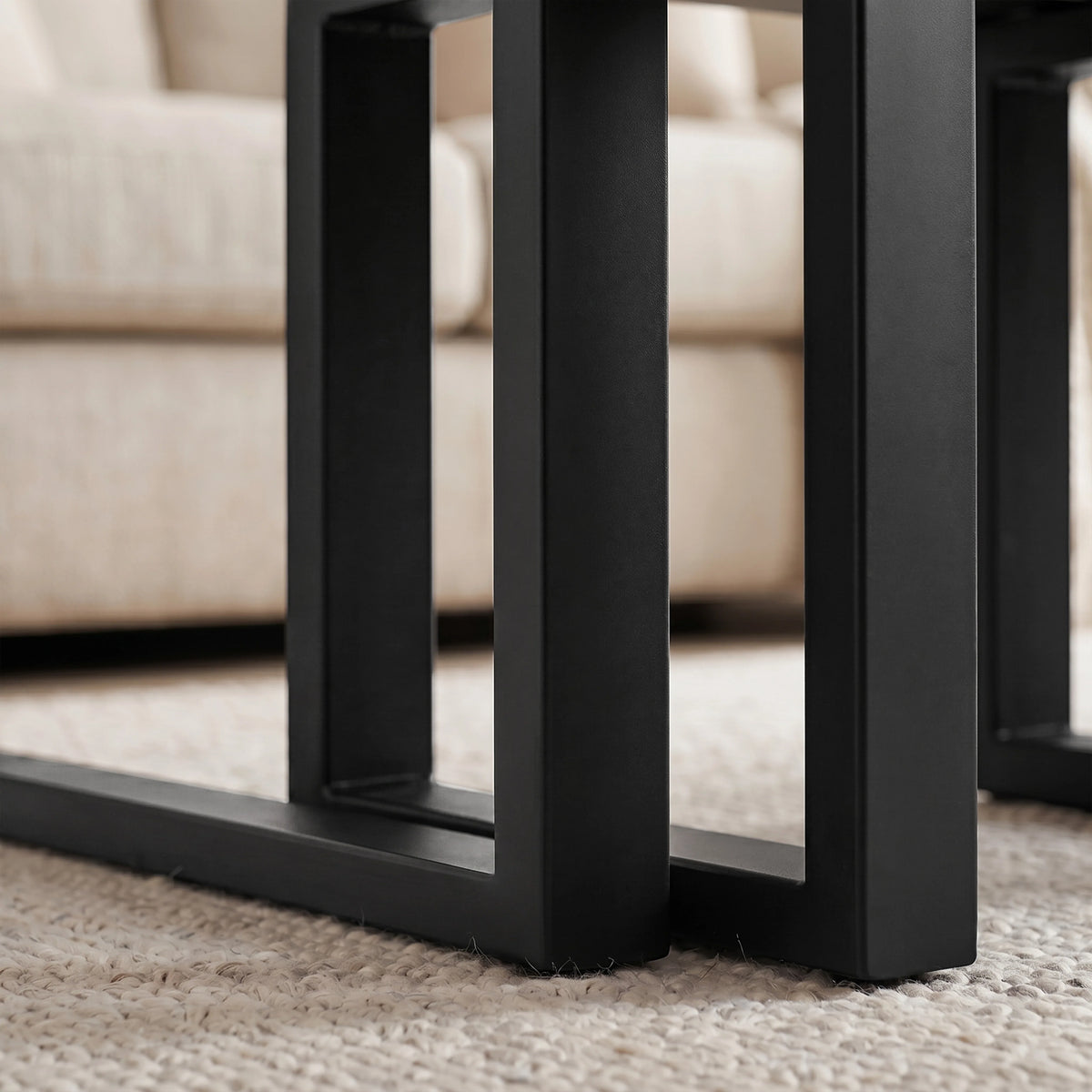 [Black] Nestline nesting table view showing nested frame detail with black metal legs aligned beneath the large table