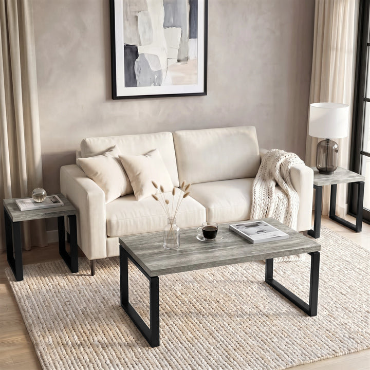 [Grey] Nestline nesting coffee table set in a living room with sofa table on sides and large table in front of beige sofa
