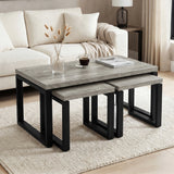 [Grey] Nestline coffee table set beside a cream sofa, with soft cushions, flowers, and nesting side tables pulled out