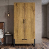 [Oak Effect] Rustvale wardrobe front view with closed double doors, lower drawer, black metal legs, concrete wall, and stool.