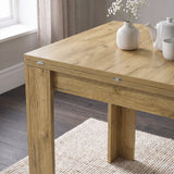 [Oak] Close-up of the folded wood-grain square tabletop, steel hinges, wide legs, flower vase, teapot and cup