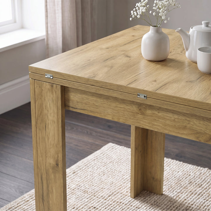[Oak] Close-up of the folded wood-grain square tabletop, steel hinges, wide legs, flower vase, teapot and cup
