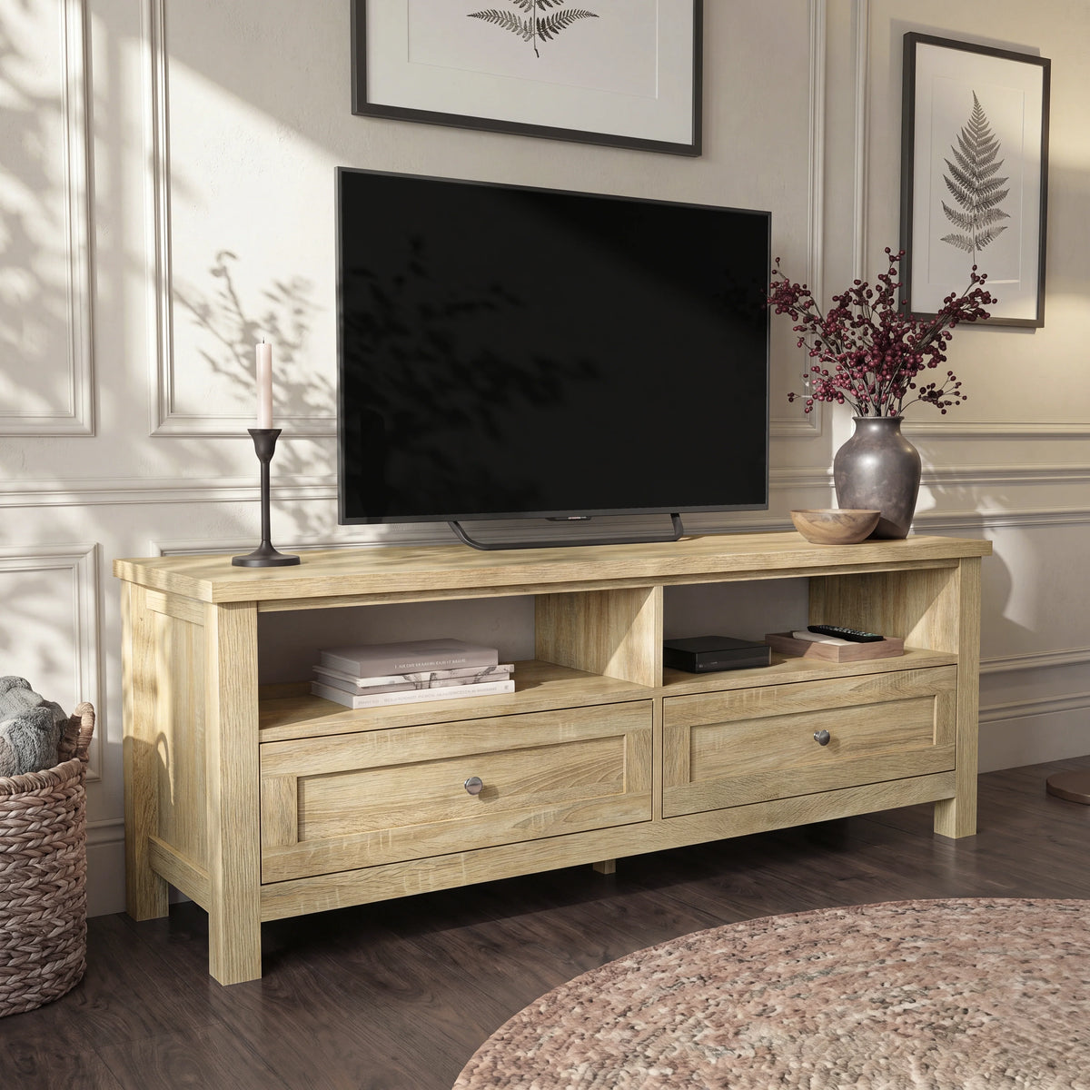 [Oak] Oskara TV Unit with Storage in oak effect finish photographed straight-on with open shelves, two panel-front drawers and a large TV above