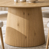 [Oak] Close-up of round pedestal dining table slatted pedestal base and wood-effect finish