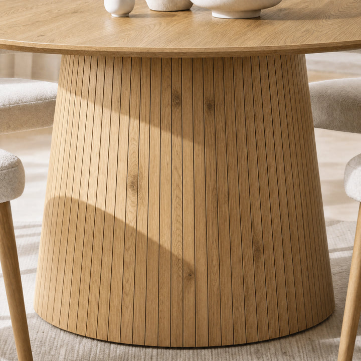 [Oak] Close-up of round pedestal dining table slatted pedestal base and wood-effect finish