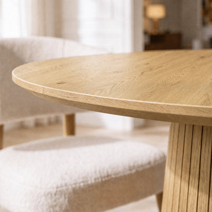 [Oak] Close-up of round pedestal dining table top edge, grain and slatted pedestal base