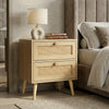 [Oak] Wovena rattan bedside angled three-quarter view, two cane drawers with round knobs and splayed legs