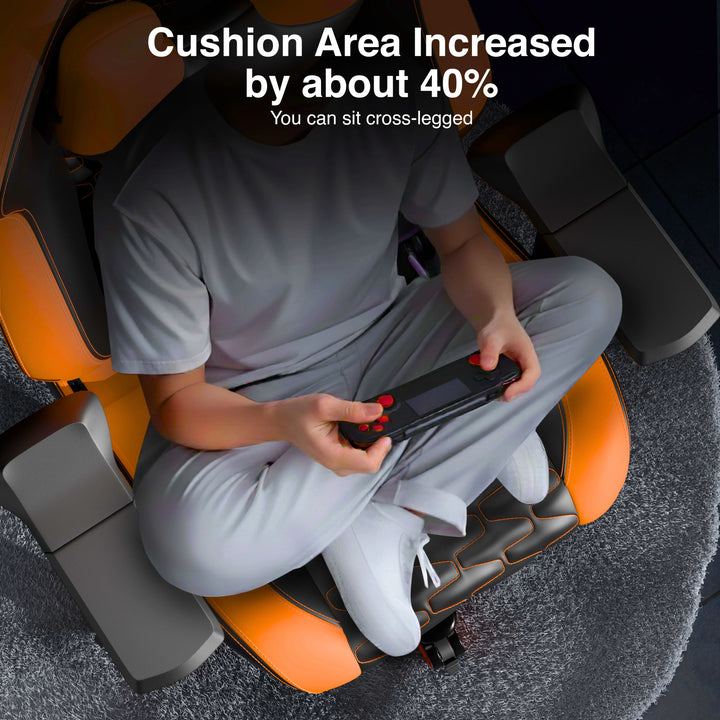 [Black + Orange] Person sitting on a massage chair with text indicating increased cushion area.