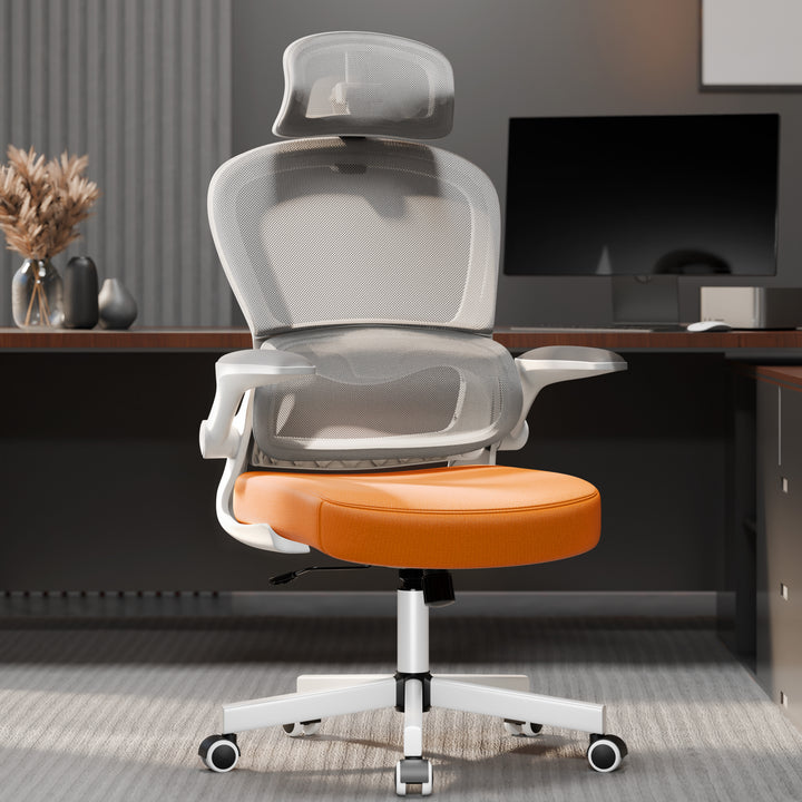 [Orange + Grey] Ergonomic computer chair with orange cushion and mesh back in a modern home office setup. Designed for lumbar support and long hours of desk work.