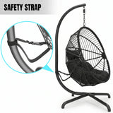 [Black] hanging chair with safety strap feature on a white background