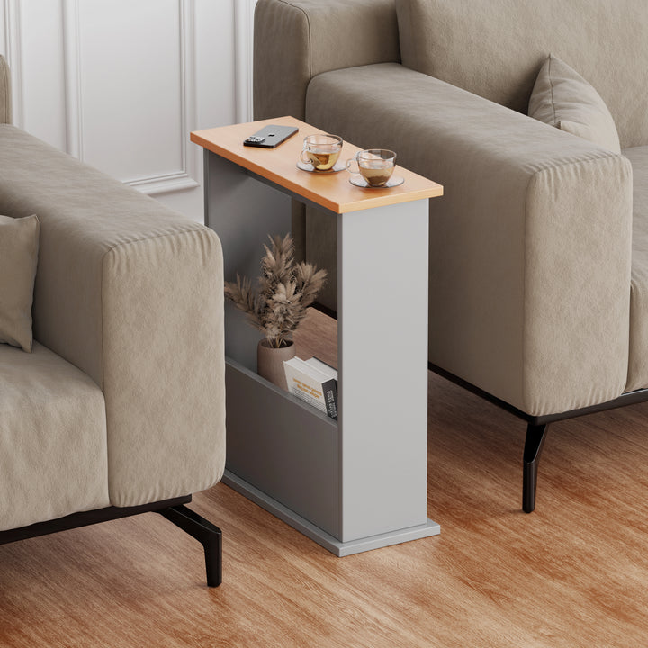 [Pine + Silver Grey] grey side table with oak top placed between sofas, coffee on surface and magazine stored below