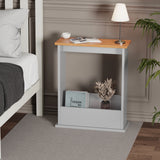 [Pine + Silver Grey] sofa end table in grey with oak top used as nightstand, books and lamp on top in minimal setting