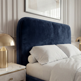 [Double | Blue] Pluva headboard detail showing smooth rounded shape with velvet upholstery beside nightstand