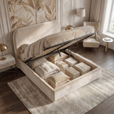 [King | Beige] Pluva ottoman bed with gas-lift base raised revealing storage filled with folded linens and cushions