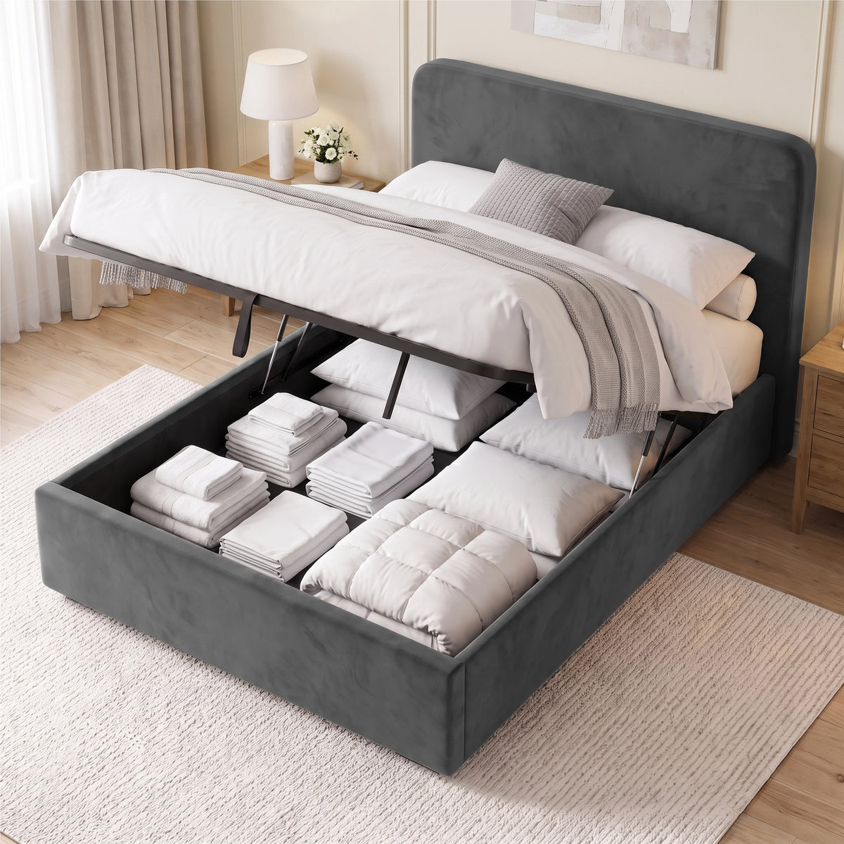 [Double | Grey] Ottoman base raised on gas struts showing storage filled with folded towels, pillows and bedding
