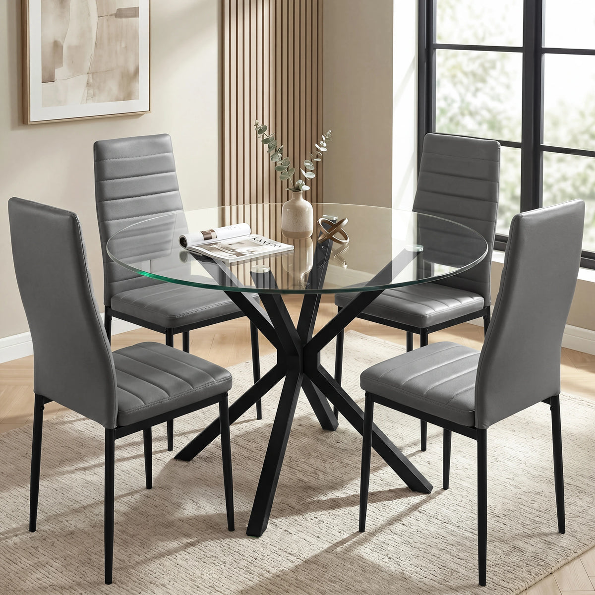 [Grey | Set of 4] PU leather dining chairs set around a glass table in a bright dining room