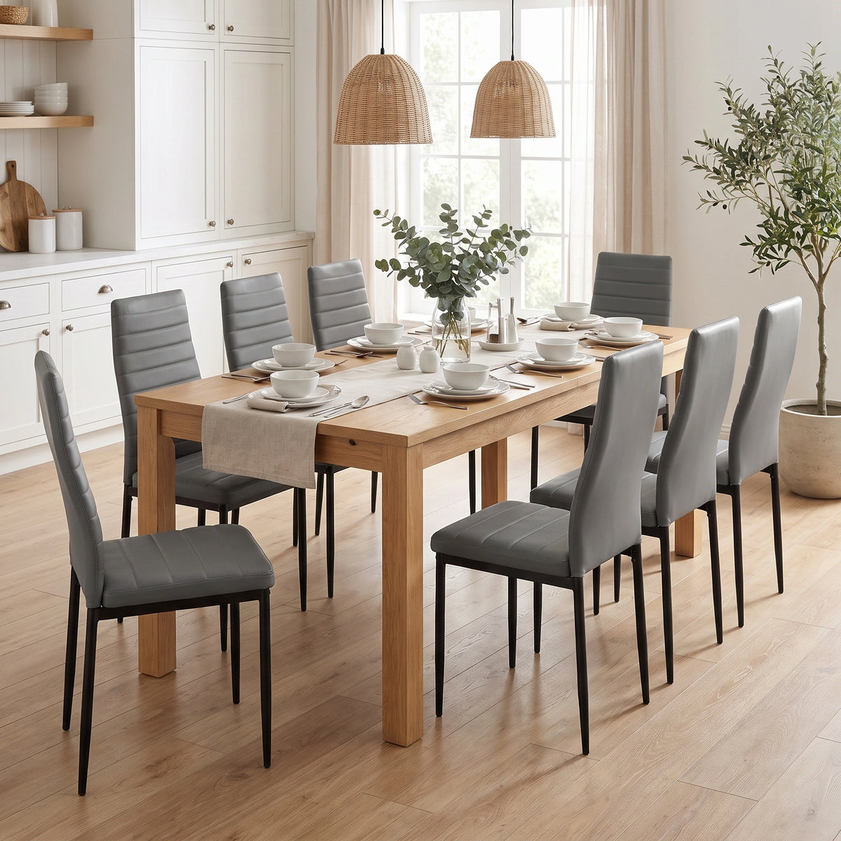[Grey | Set of 8] PU leather dining chairs set around a wooden dining table in a bright dining room