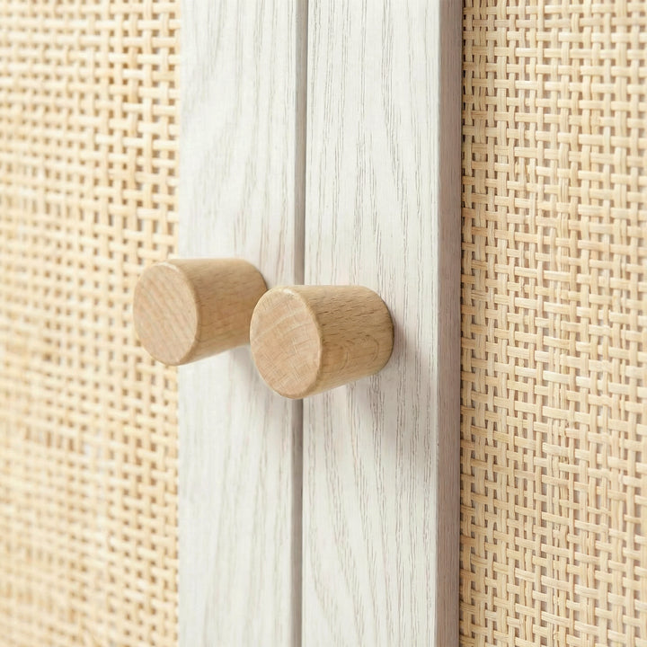 [White] Wovena Rattan 3 Door Sideboard - Adjustable Shelf White macro detail shot of the cylindrical natural wooden knobs.