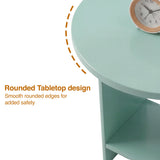 [Sage Green] Rounded tabletop edge close-up of sage green round side table with rose-gold clock on surface