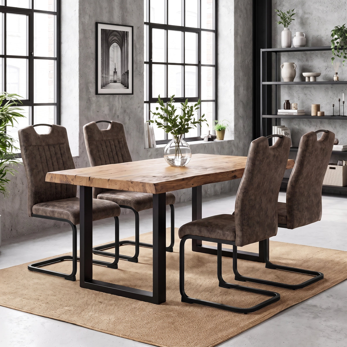 [Rust Brown] Four high-back dining chairs with black loop frames around a wood table styled with a plant vase.