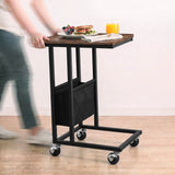 [Rustic] movable side table being rolled on caster wheels with snacks and drink on tabletop