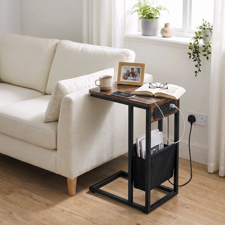 [Rustic] sofa side table side view with rustic wood-effect top, socket panel, tea, power cable and storage pouch