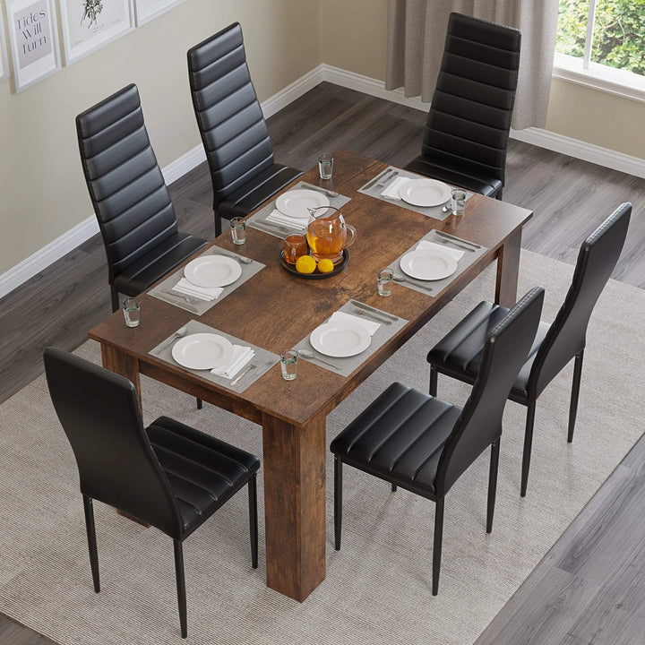 [6 Seater | Black] Top down view of rustic dining set with six black chairs and orange fruit bowl